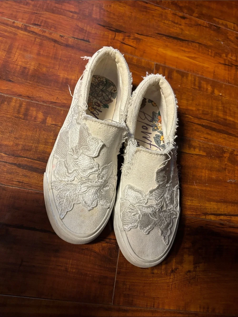 Women's Distressed Slip-On Sneakers with Floral Lace Appliqué in White